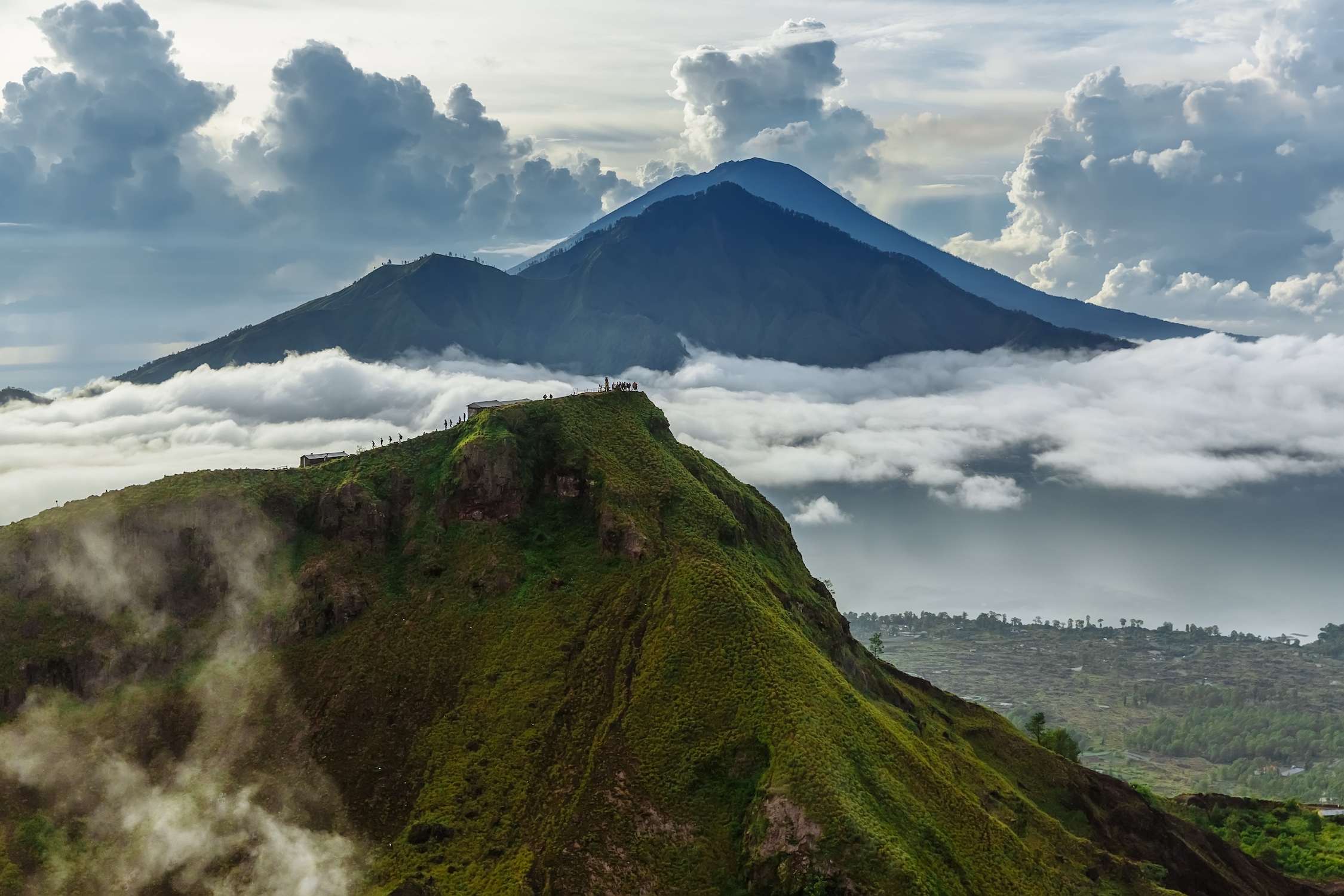 Active Indonesian volcano Batur in the tropical island Bali. Indonesia. Batur volcano sunrise serenity. Dawn sky at morning in mountain. Serenity of mountain landscape, travel concept