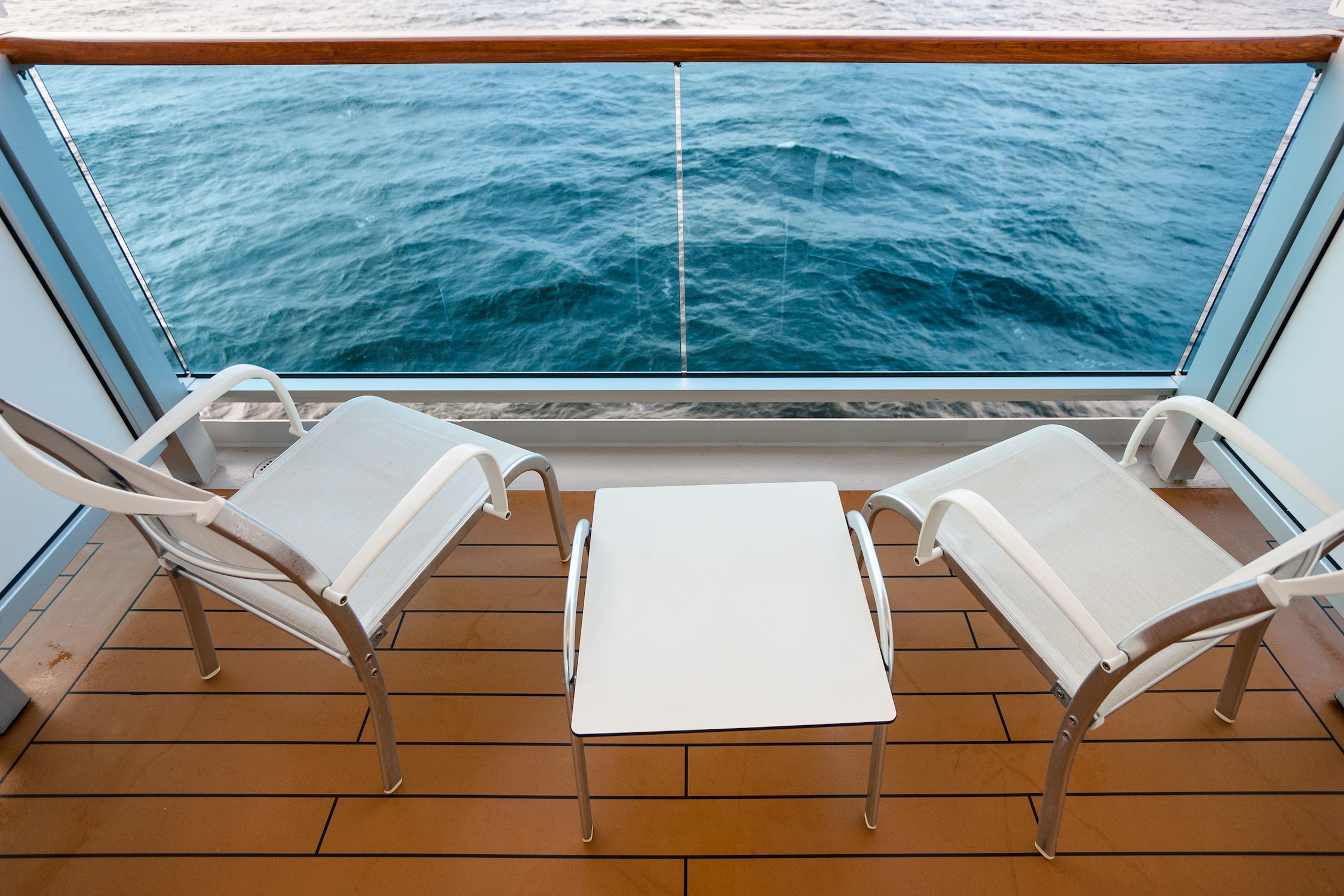 chairs and table on board of cruise liner