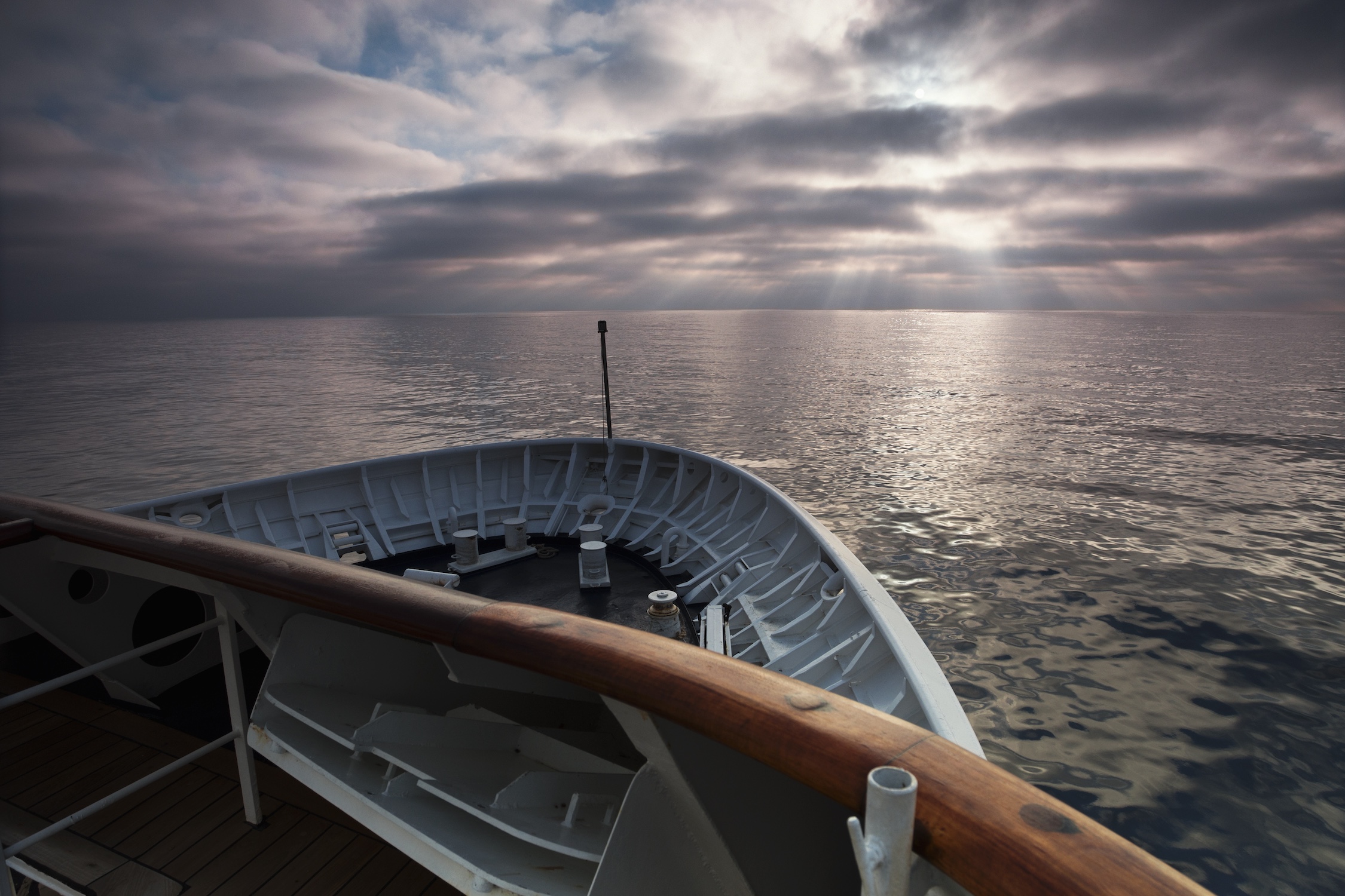 Cruise ship,France,View across the ocean from the bow of a cruise ship at dawn.